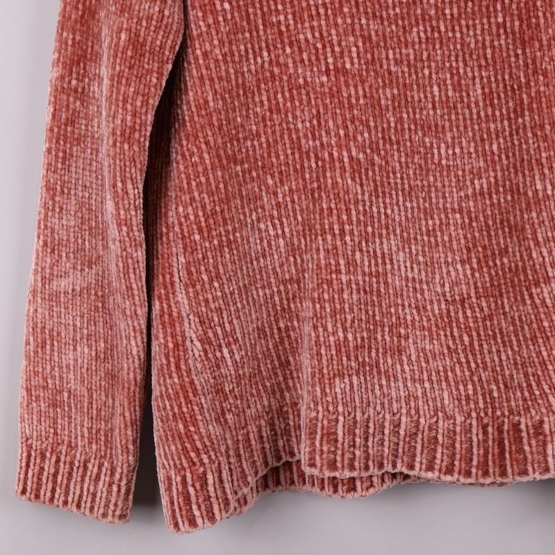 Närbild av tröjans struktur vid ärmen