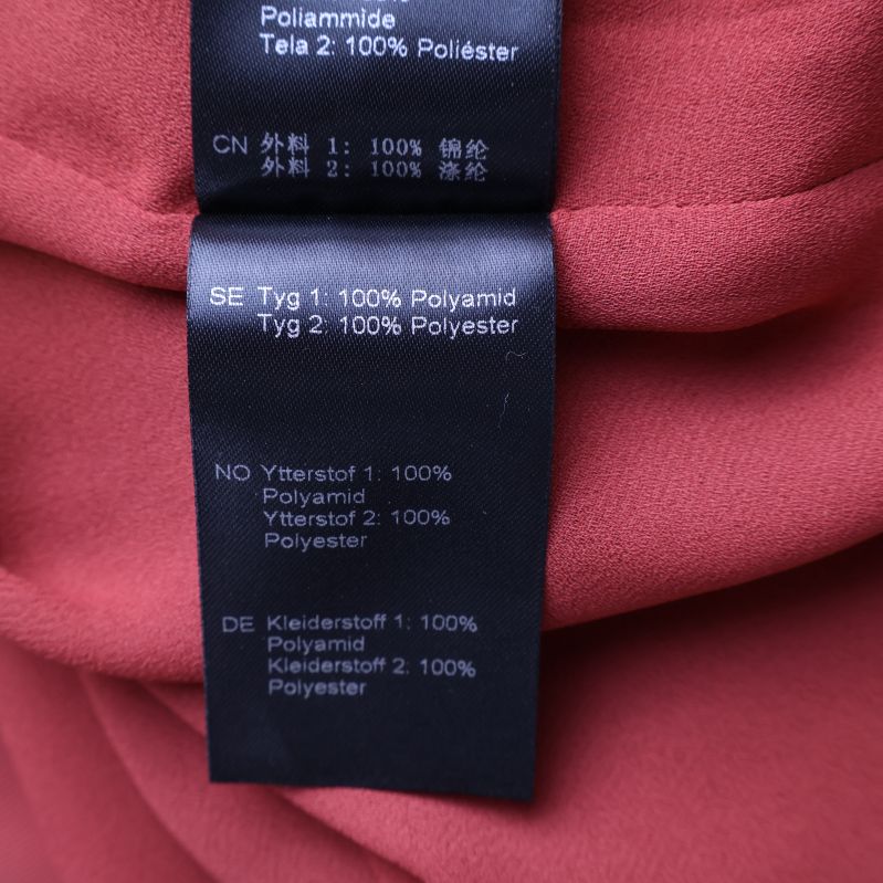 Materialetikett med polyamid och polyester
