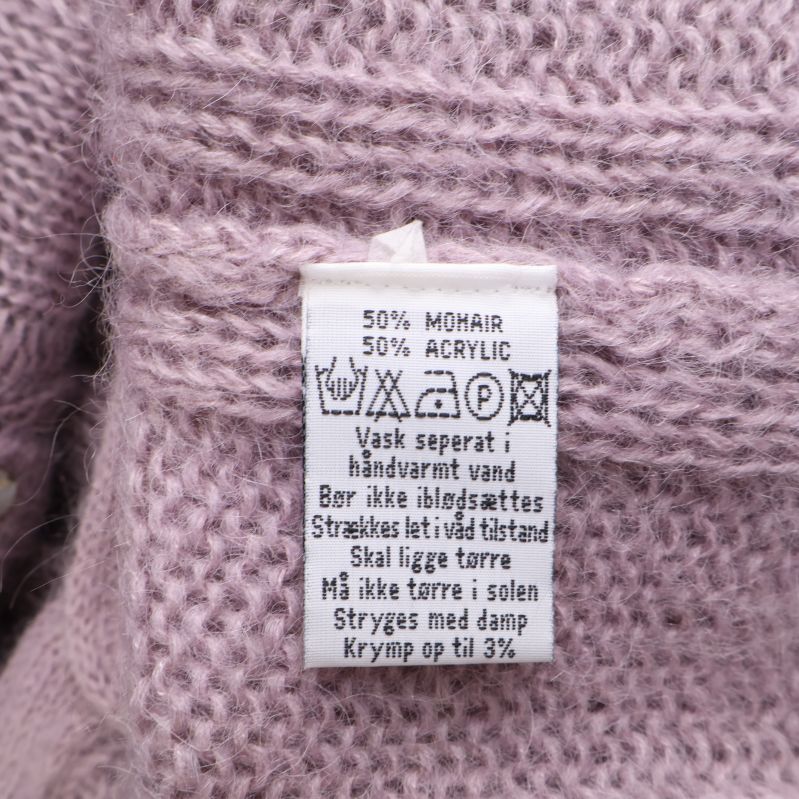 Materialetikett med 50% mohair och 50% akryl