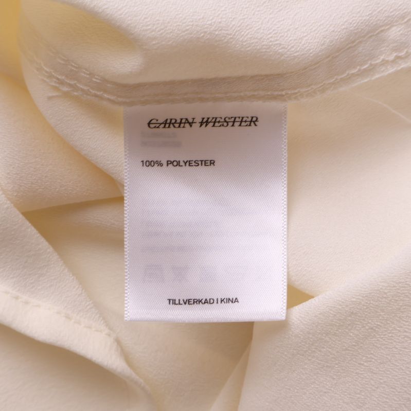 Etikett med material 100% polyester
