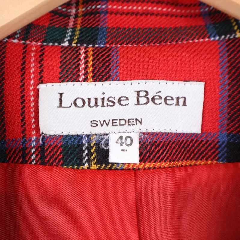 Närbild av etikett med varumärke 'Louise Béen' och storlek 40