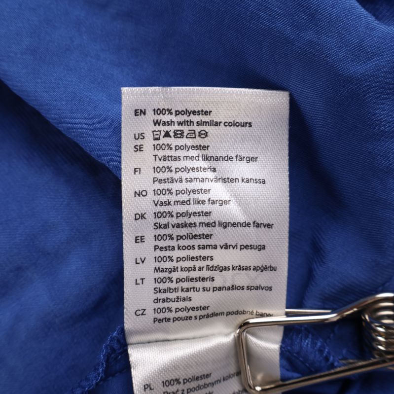 Etikett med tvättråd för polyester