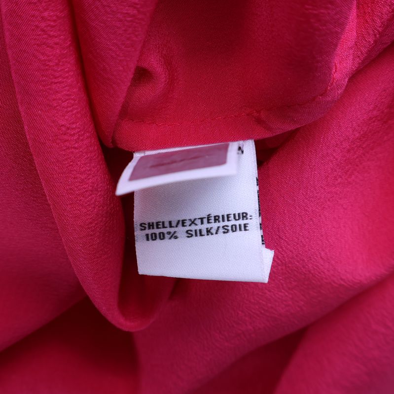 Tygetikett med materialinformation 100% siden