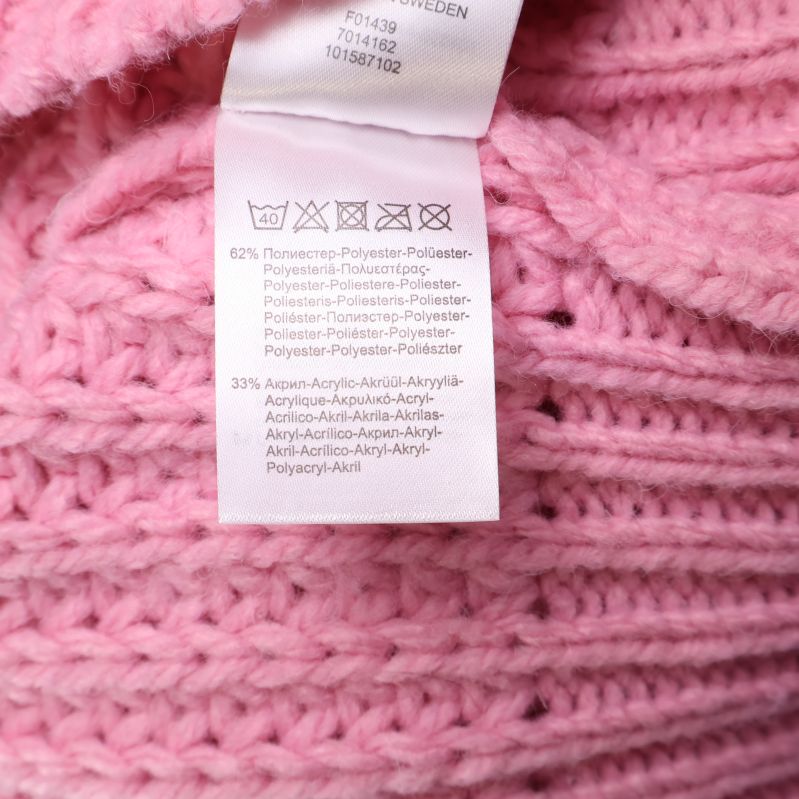 Materialetikett med komposition för rosa tröja