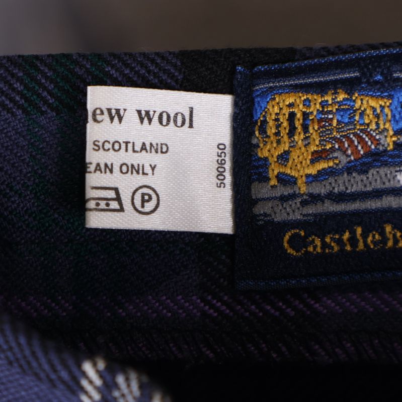Tvättlapp med materialinformation 'New Wool'