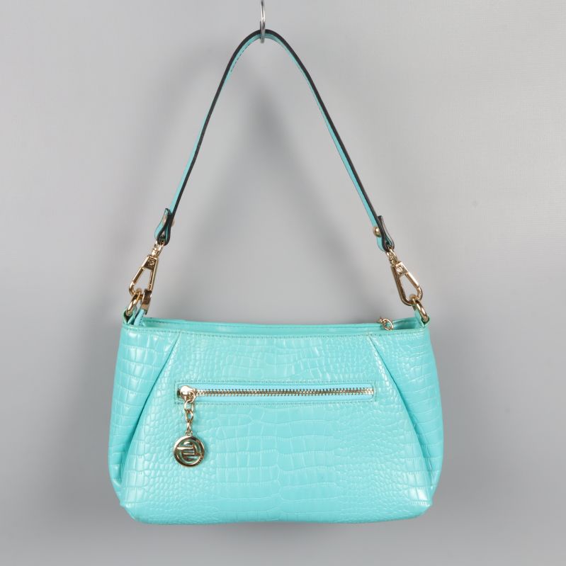 Baksidan av turkos väska med dragkedja