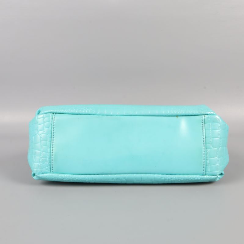 Undersidan av turkos väska utan mönster