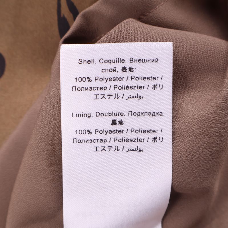 Materialetikett visar polyester innehåll