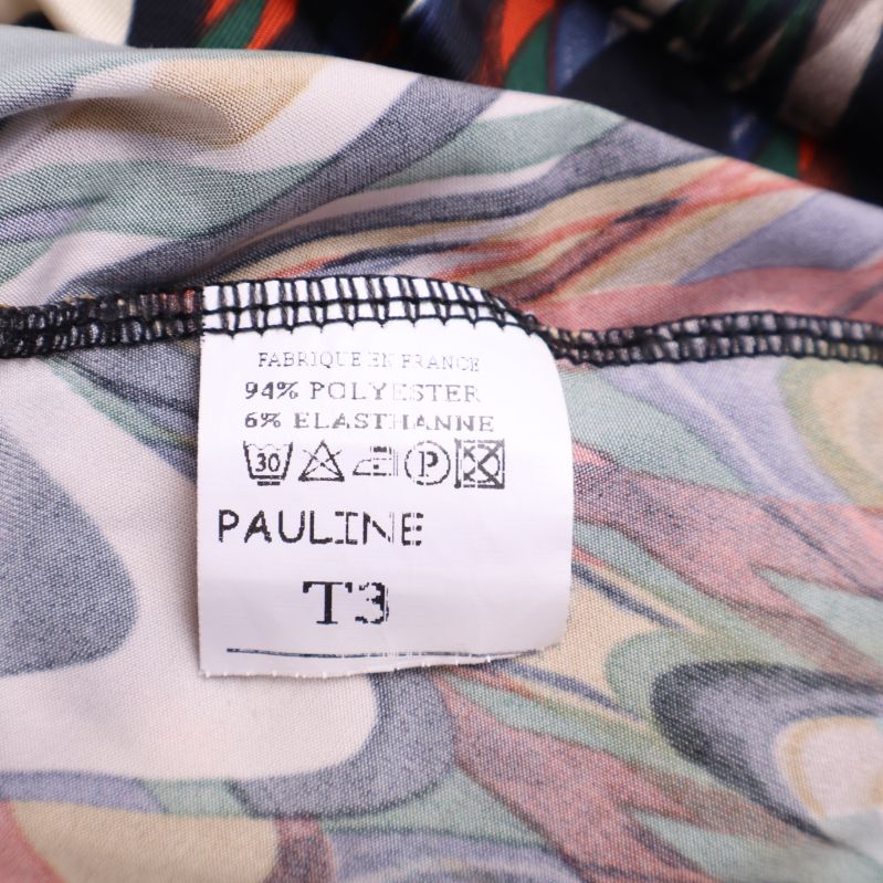 Materialetikett visar polyester och elastan