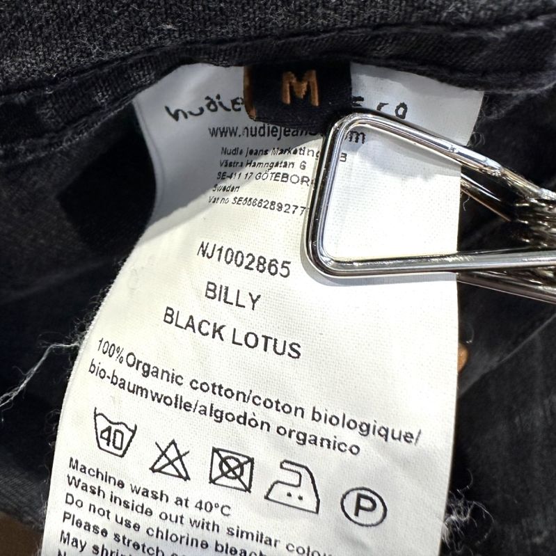 Märkesetikett med materialinformation