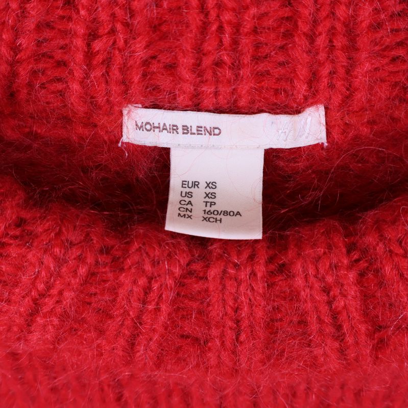 Storlekstagg och materialetikett för mohairblandning