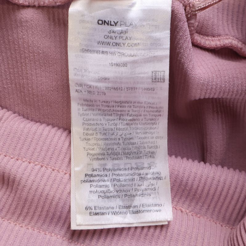 Materiallapp med innehåll till ljusrosa leggings