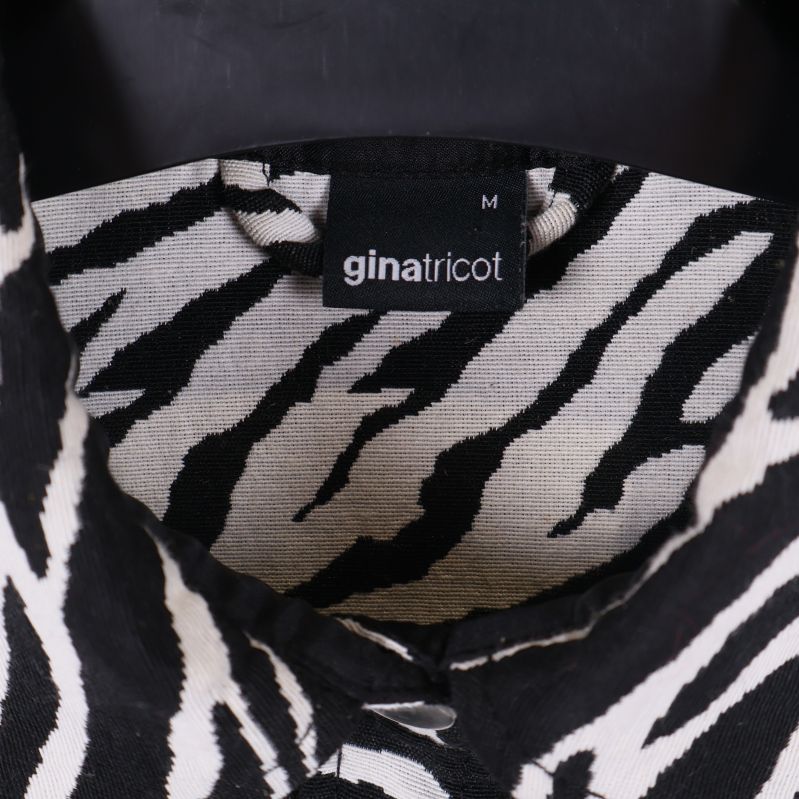 Gina Tricot etikett med storlek M
