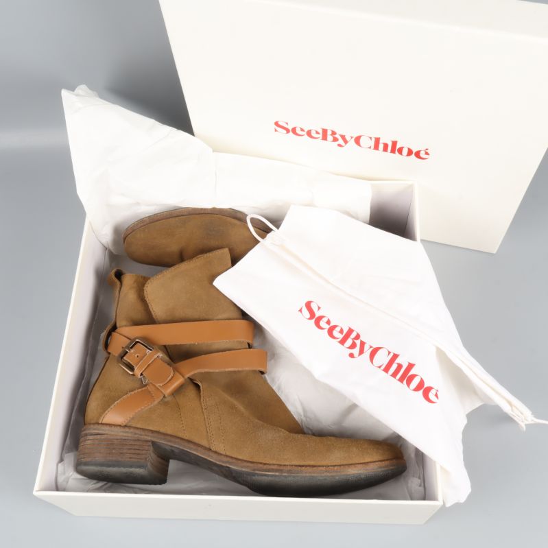 Ett par boots i box med tillhörande dustbag