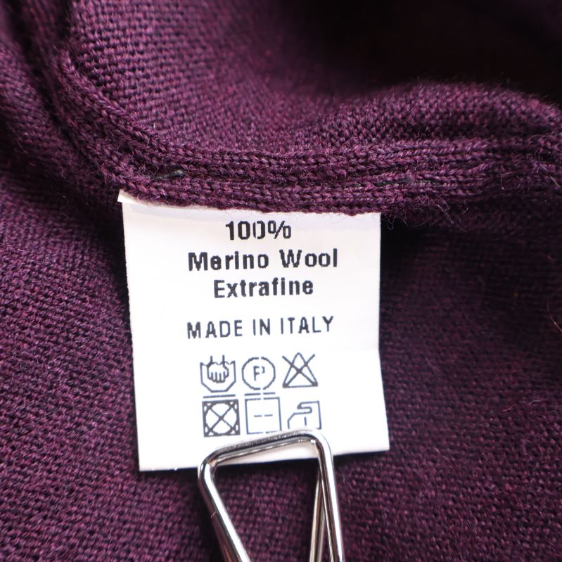 Materialetikett 100% merinoull extrafin tillverkad i Italien