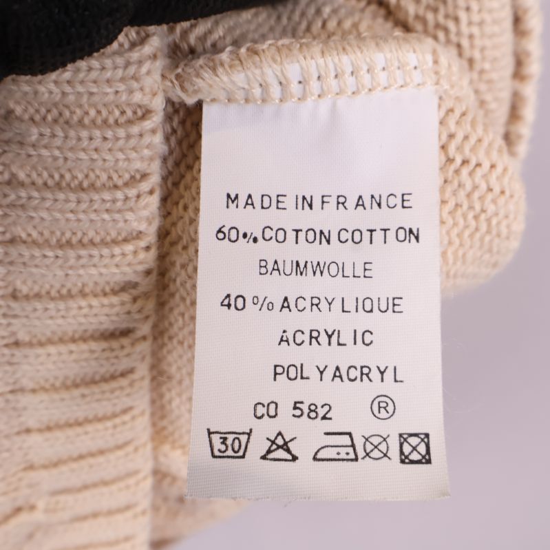 Materiallapp som visar 60% bomull och 40% akrylfiber