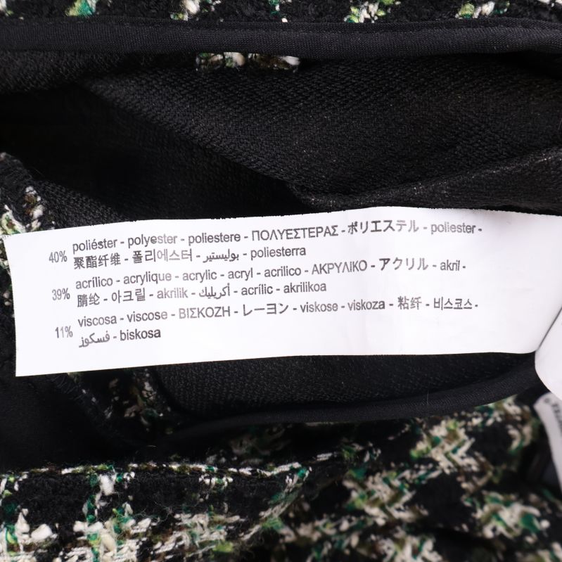 Materiallapp visar polyester, akryl, viskos, elastan