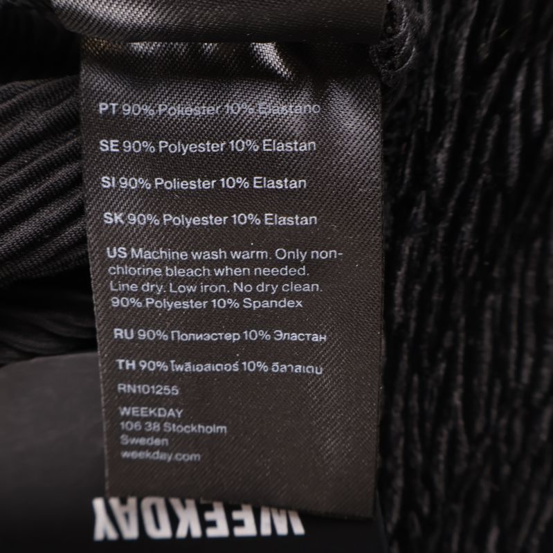 Tyglabel med material 90% polyester och 10% elastan