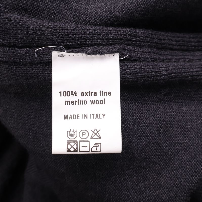 Materiallapp med texten 100% extra fin merinoull