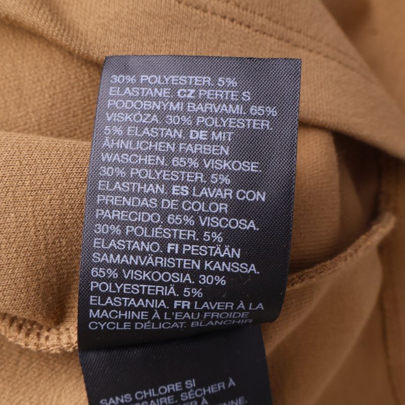 Materialetikett med materialprocent på olika språk