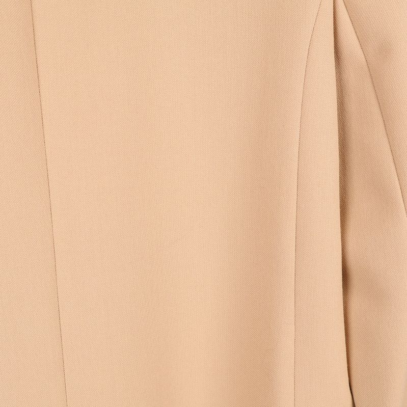 Närbild på beige tyg utan mönster
