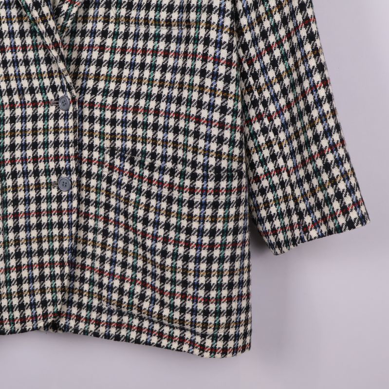 Närbild av ärm på kavajen