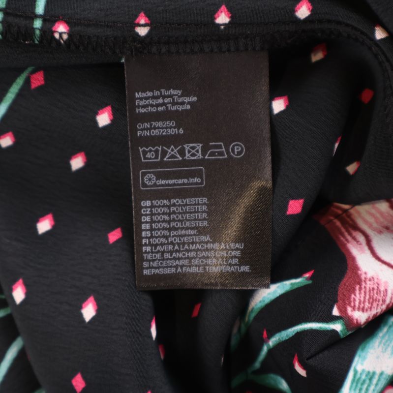 Materiallapp som visar 100% polyester