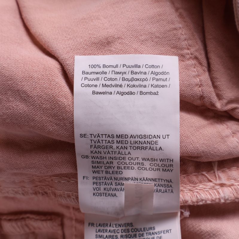 Materiallapp med text 100% bomull och tvättråd
