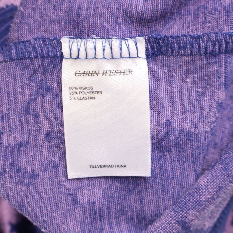 Materiallapp som visar sammansättning av viskos, polyester och elastan