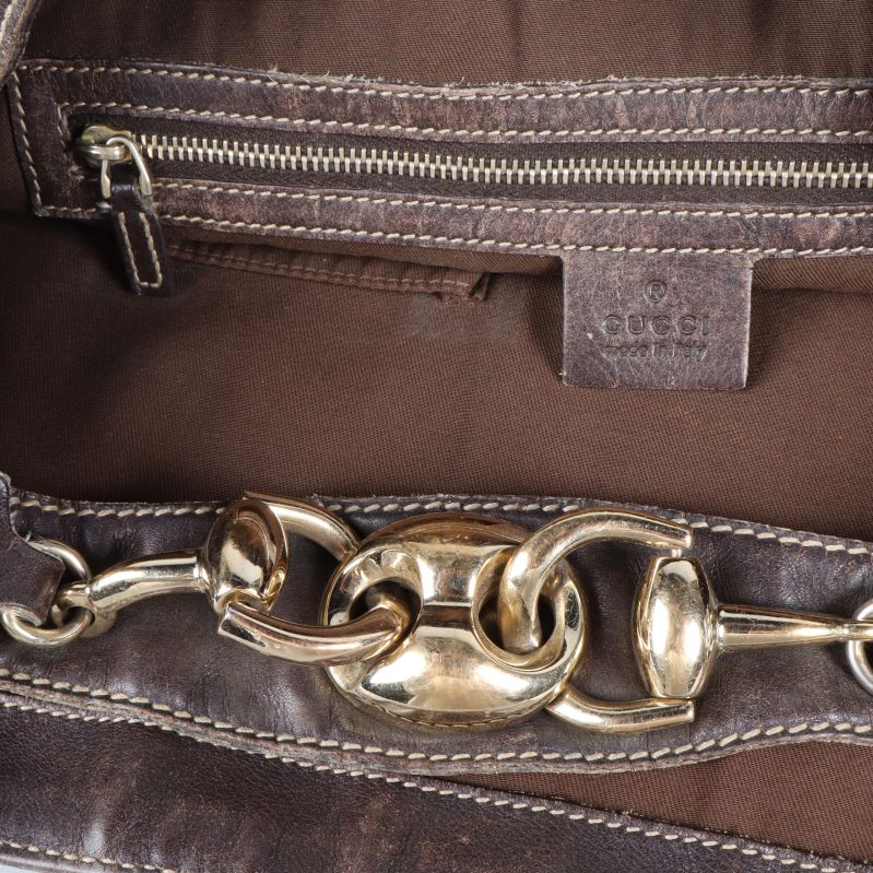 Insida av väska med ficka, brun textil och Gucci-logotyp