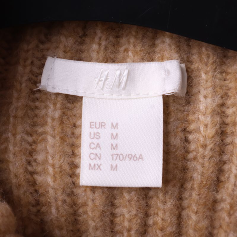 Storleksetikett från H&M med storlek M