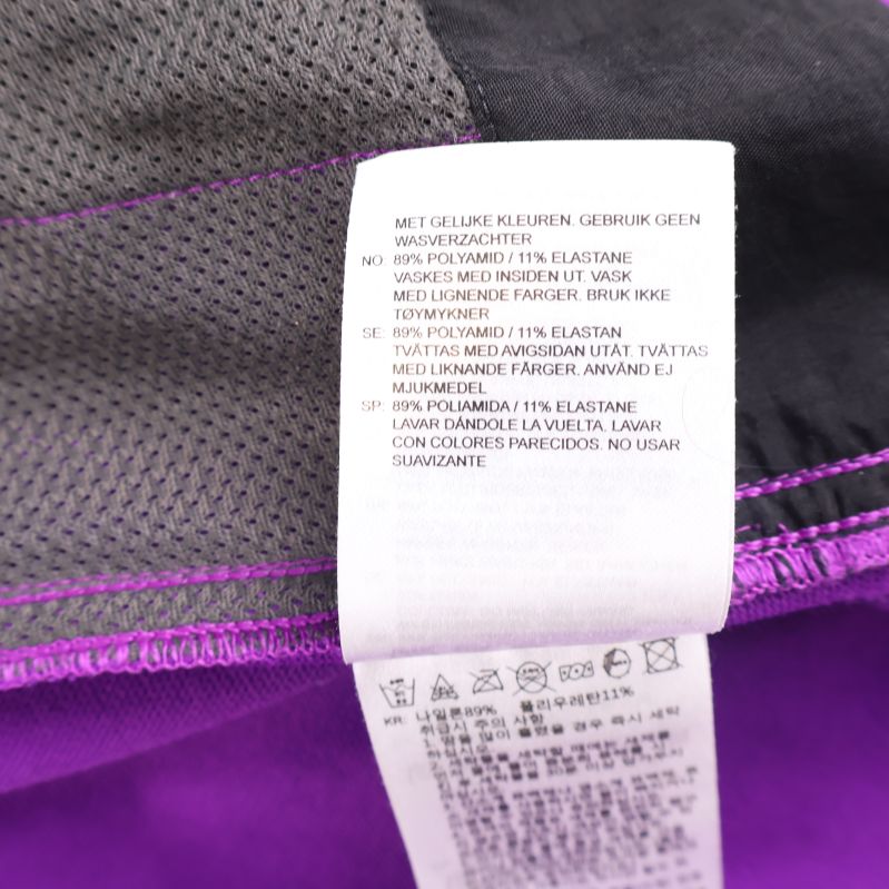 Materiallapp med information om polyester och elastan