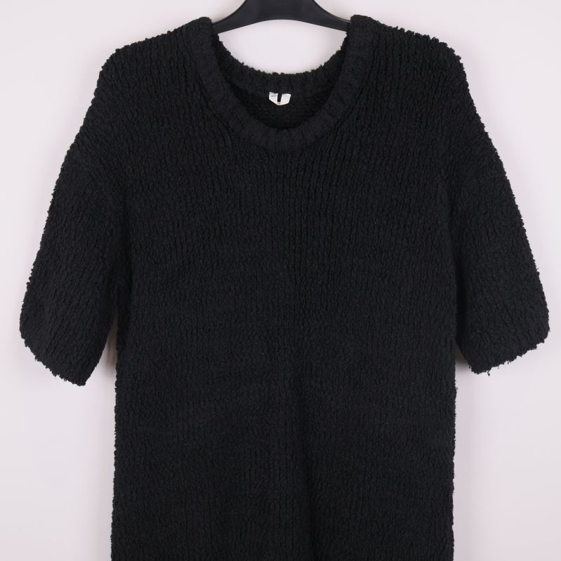 Närbild på tröjans ovandel och struktur