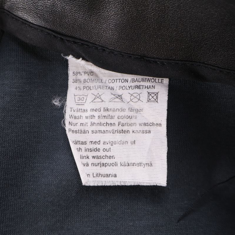 Tvätt- och materialetikett som visar sammansättning