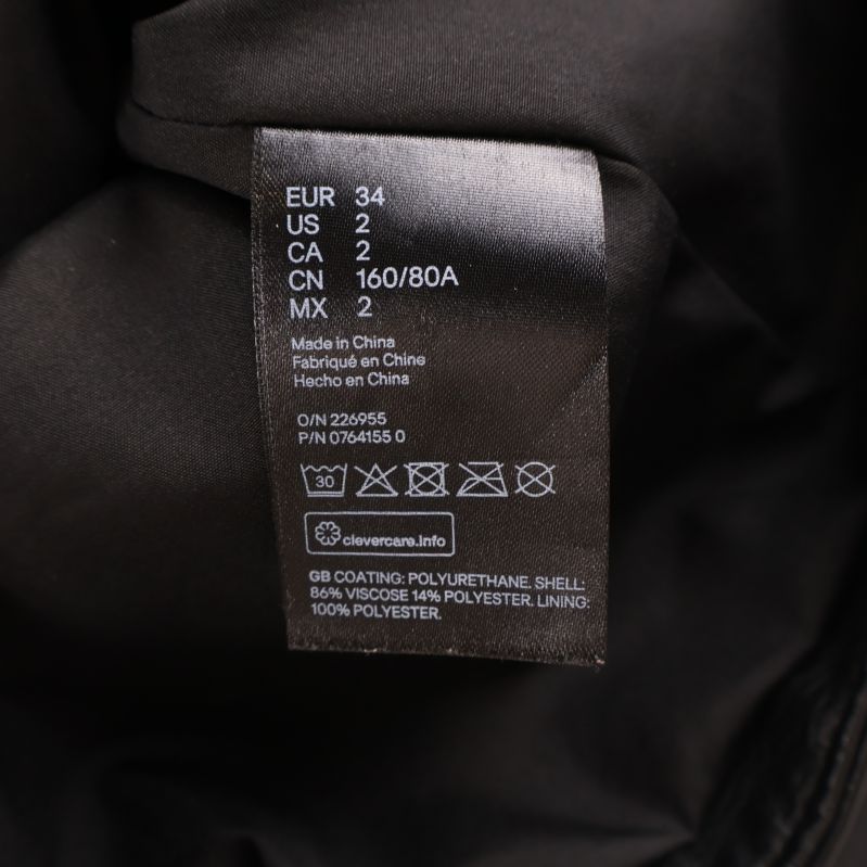 Materialetikett som visar skal, foder och material