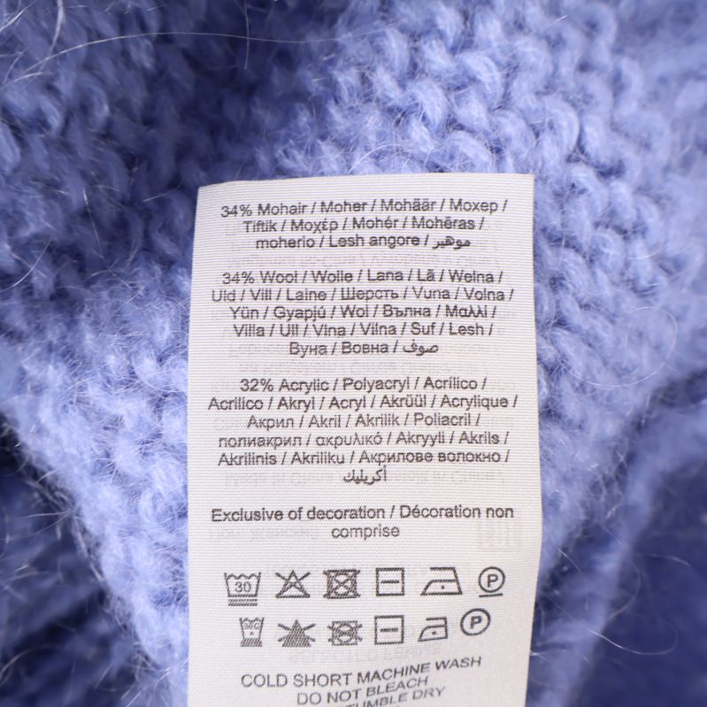 Materialmärkning med procent på vit etikett