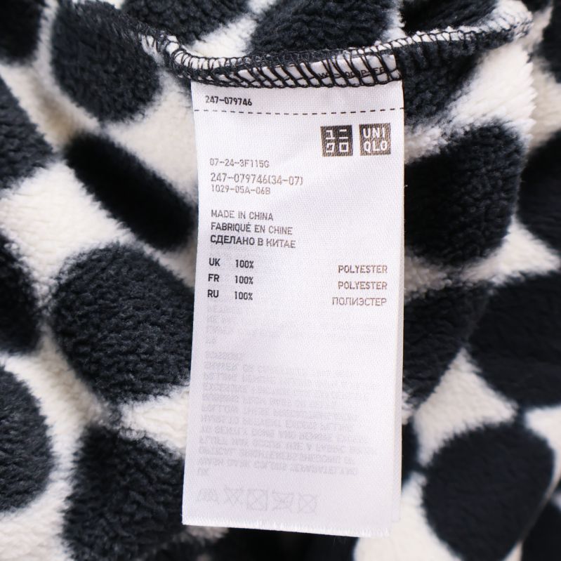 Materiallapp med information om 100% polyester