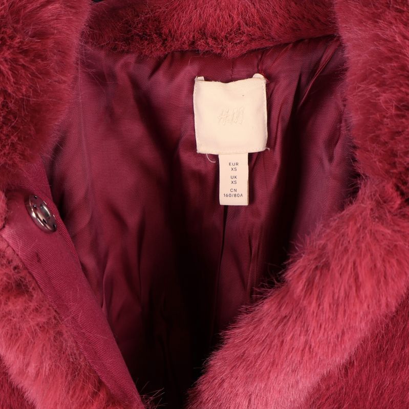 Närbild på insidan och storleksetikett XS