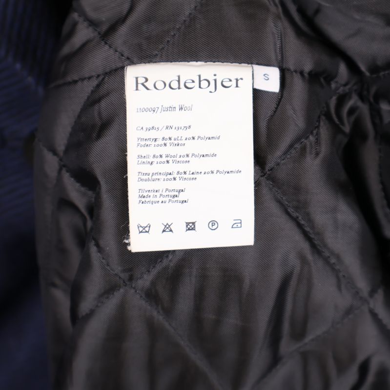 Materiallapp som anger ull och polyamid