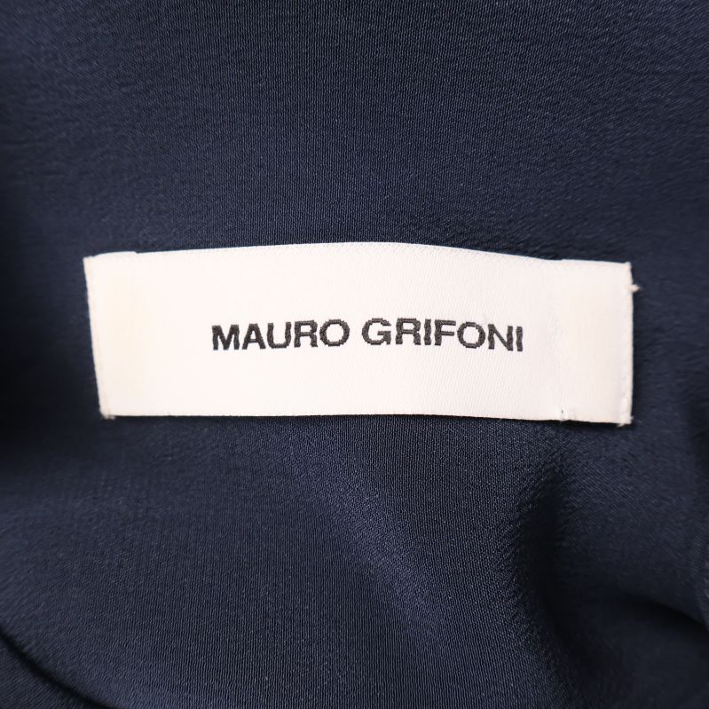 Etikett med varumärke Mauro Grifoni på insidan av blusen