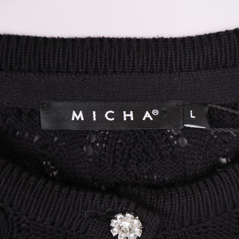 Micha-märke och storlek L i kragen på kofta