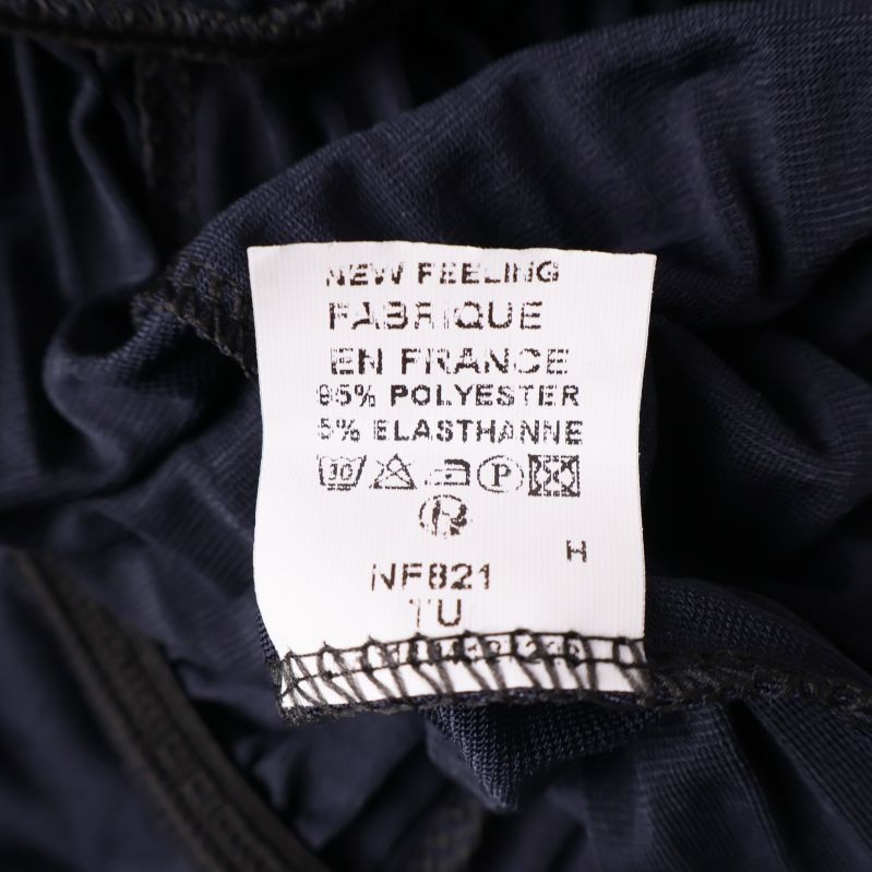 Materiallapp som visar 95% polyester och 5% elastan