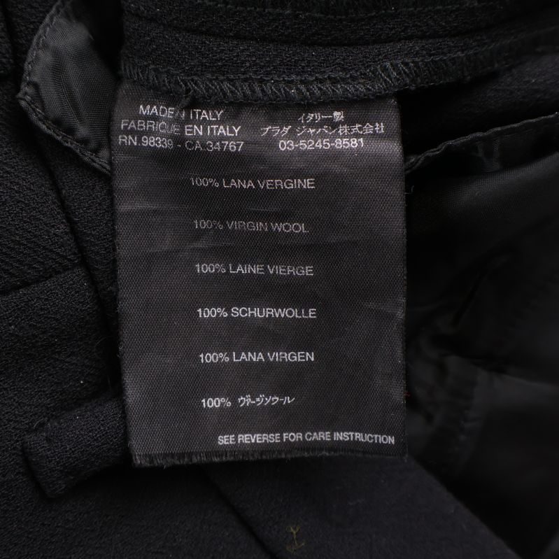 Tvätt- och materialetikett med 100% ull på flera språk