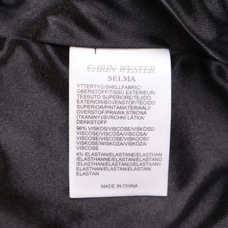 Materiallapp med materialinformation: viskos, elastan