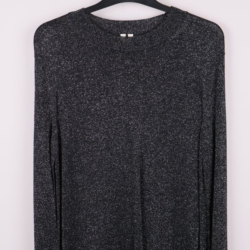 Övre delen av svart glittrig klänning och ärmar