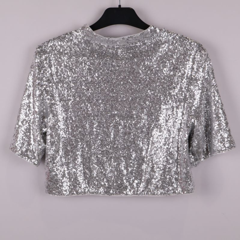 Baksidan av silvrig paljettop