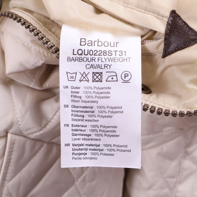 Materiallapp med text om polyamidfiber och tvättråd