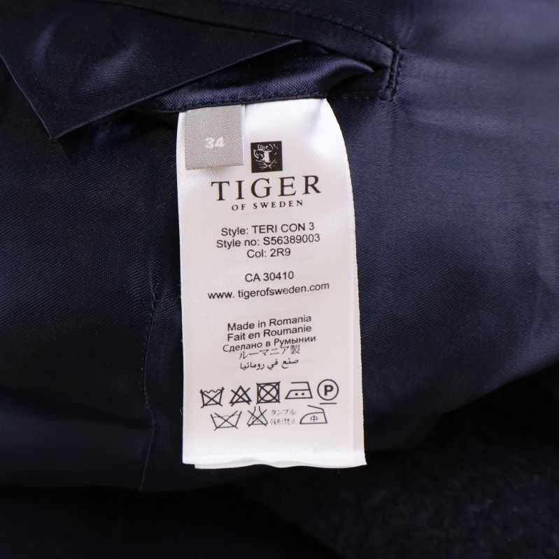 Tvättlapp med Tiger of Sweden-logo och tillverkningsinformation