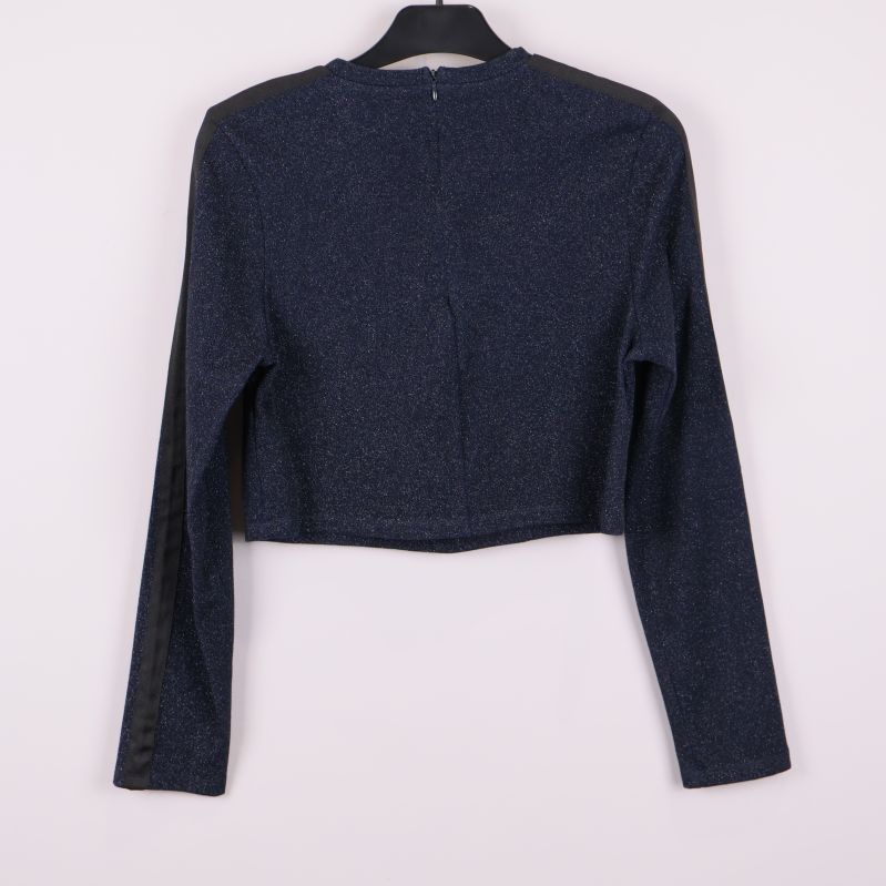 Baksida av mörkblå glittrig croppad topp med dragkedja