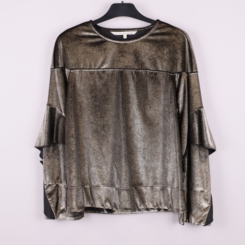 Glittrig topp med volangärmar framifrån